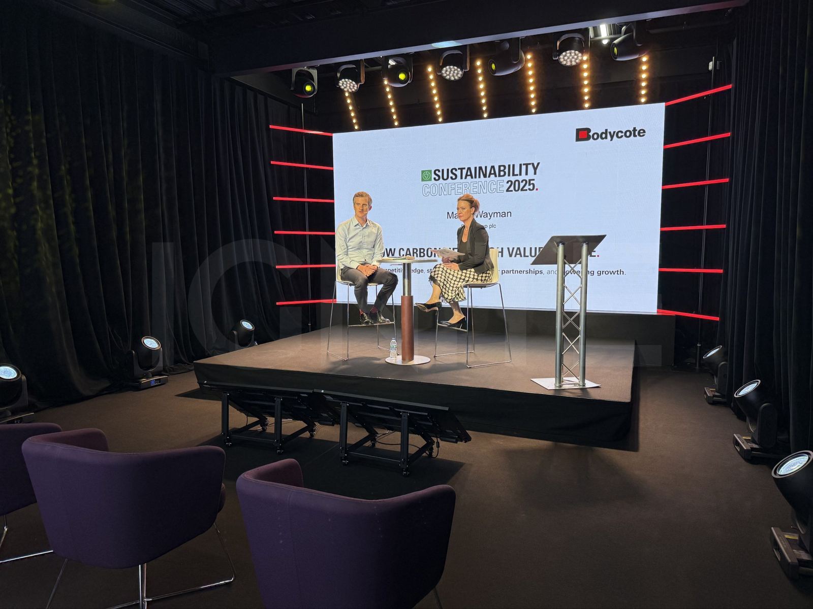 Bodycote interview on the Studio A stage, with seating for a live audience