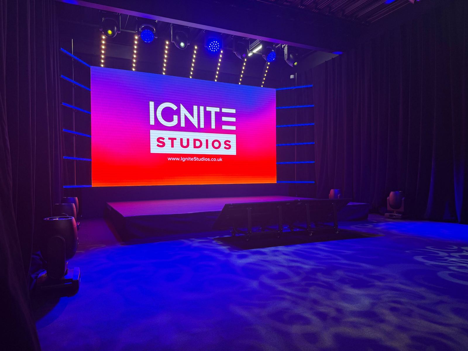 Studio A stage with the IGNITE Studios logo on the LED wall